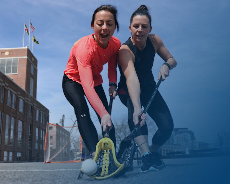 two female athletes playing outside